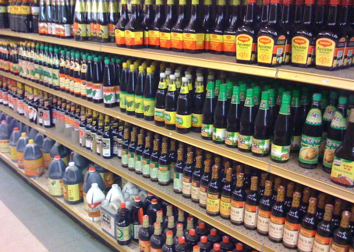 Shelves of different soy sauce types